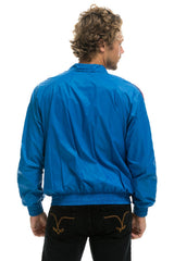MEN'S 4 STRIPE WINDBREAKER -  SNORKEL BLUE